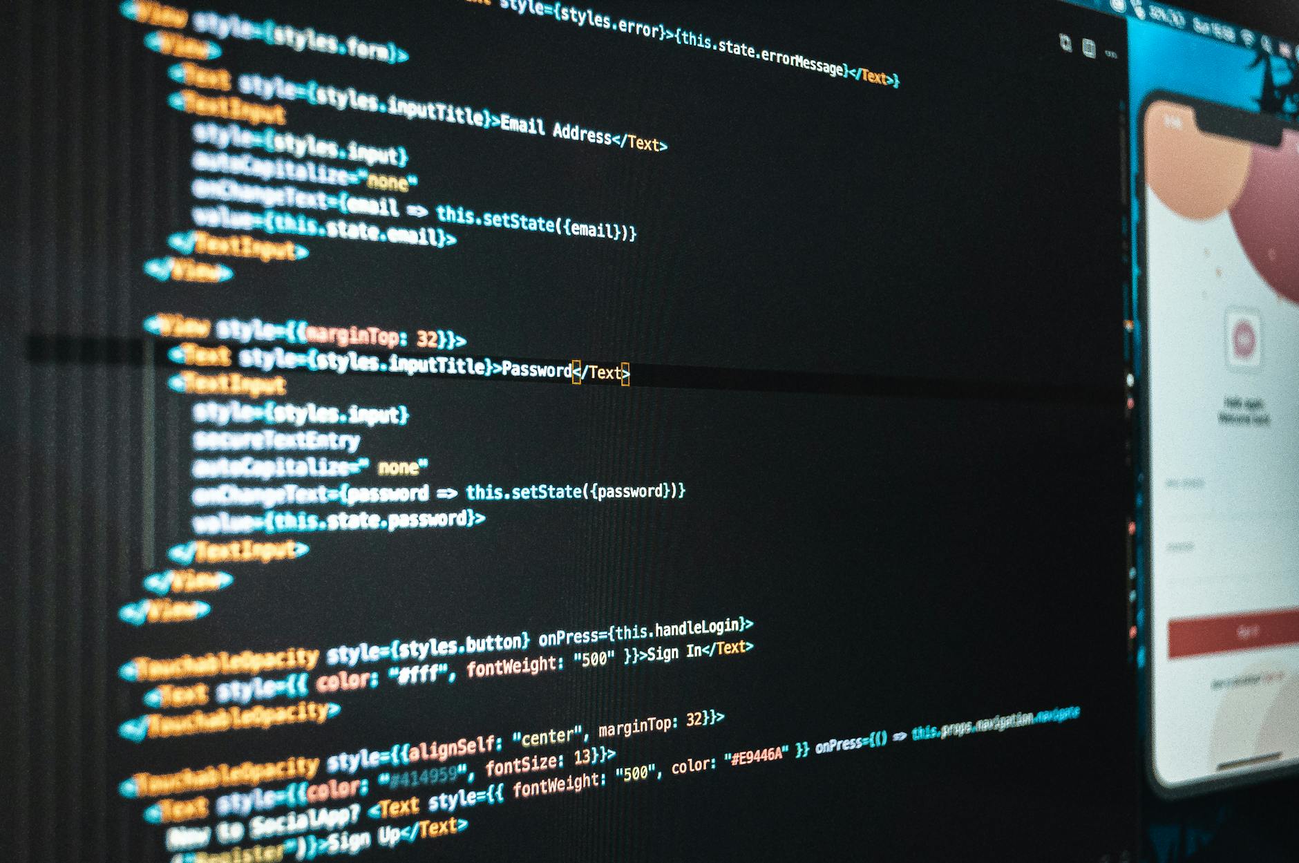 Monitor z kodem aplikacji w nowoczesnym biurze IT